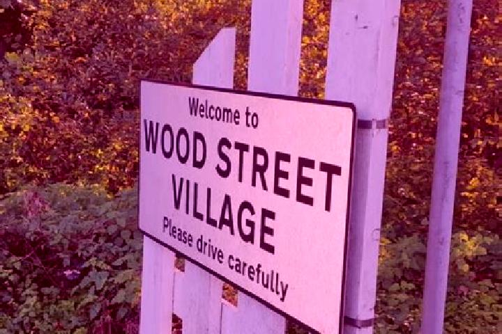 escort Wood Street Village